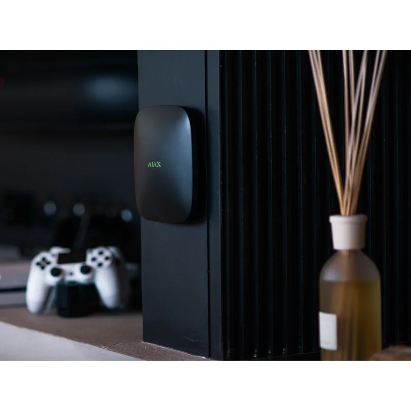 Ajax Hub Black installed on black wall