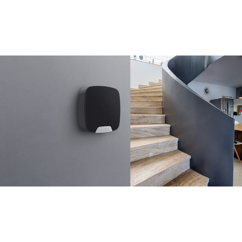 Ajax HomeSiren Black installed on inside wall