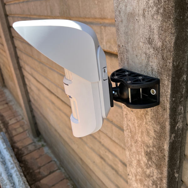 RoboGuard Ball Type Mounting Bracket with Ajax detector fitted and installed on a wall